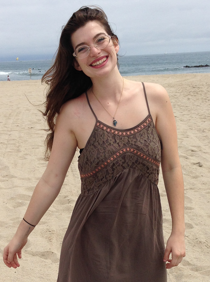 a-woman-that-is-happily-on-a-yoga-mat-in-a-flexibl-B4LDLZF